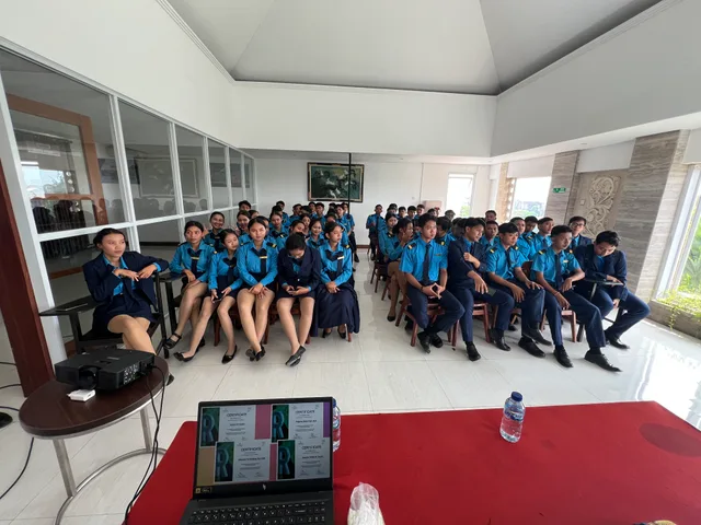 Students seated in rows during a campus gathering